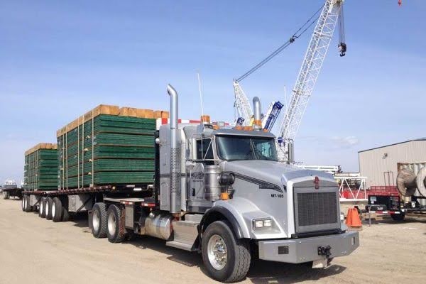 A truck carrying matting for a job site