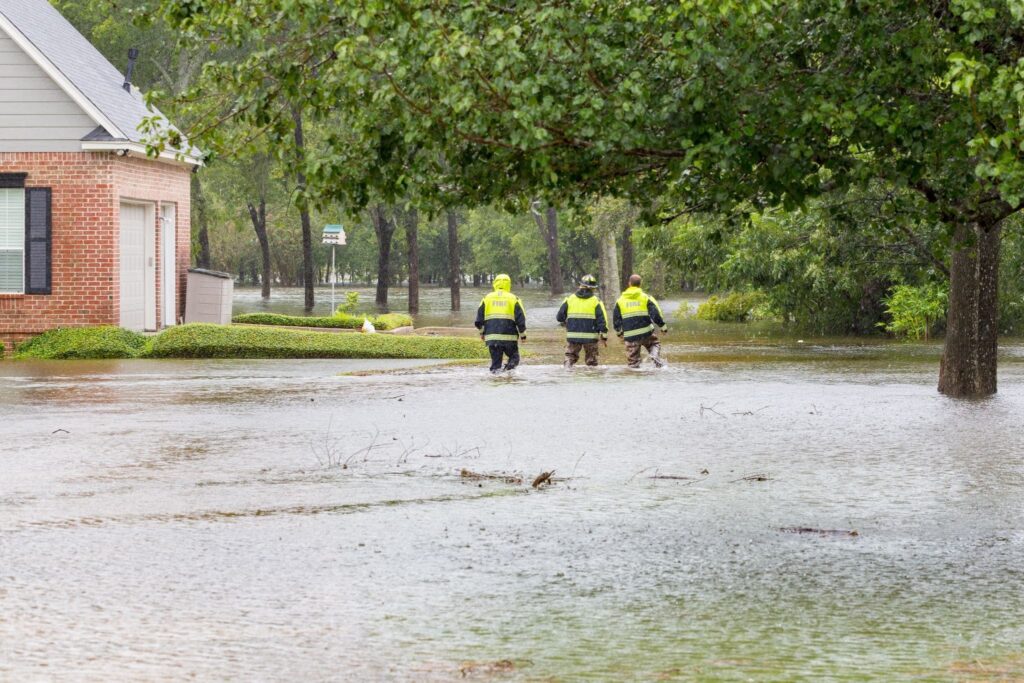 First responders inspecting flooded residences in Houston, TX after a hurricane